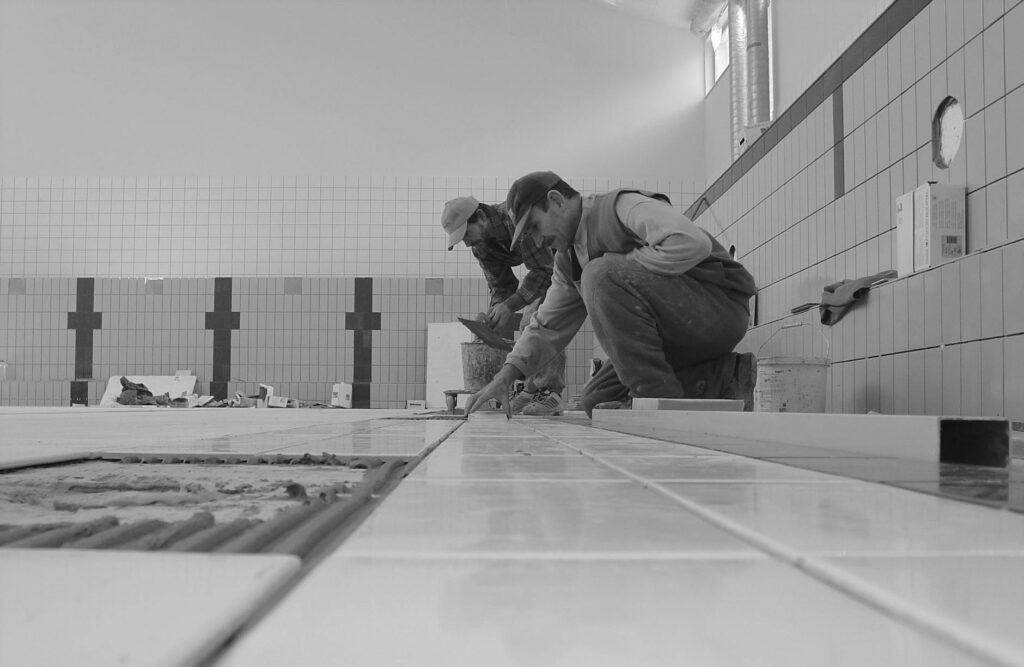 two carpenters in a bathroom