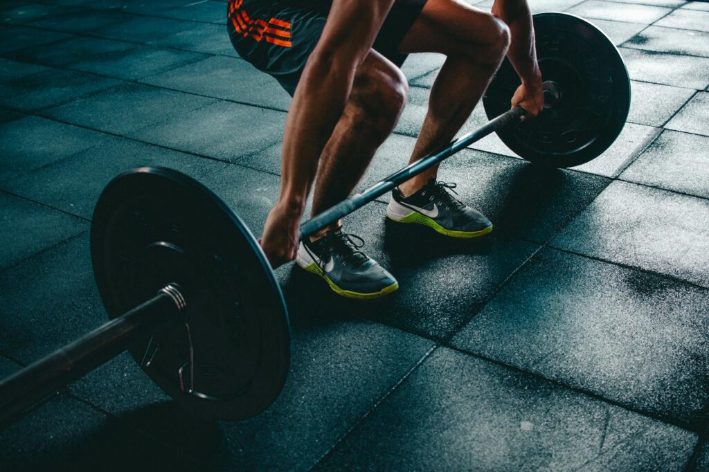 person holding barbell